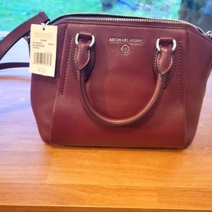 Michael Kors New Sienna medium messenger purse!  The color is Merlot!